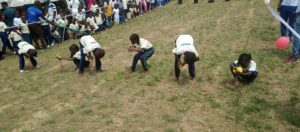 Competitors during the fill-in the bottle race